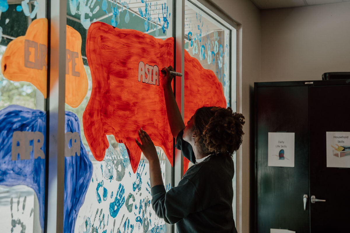 mural of the seven continents at Quest's Training Center in Tampa thanks to Las Damas grant.