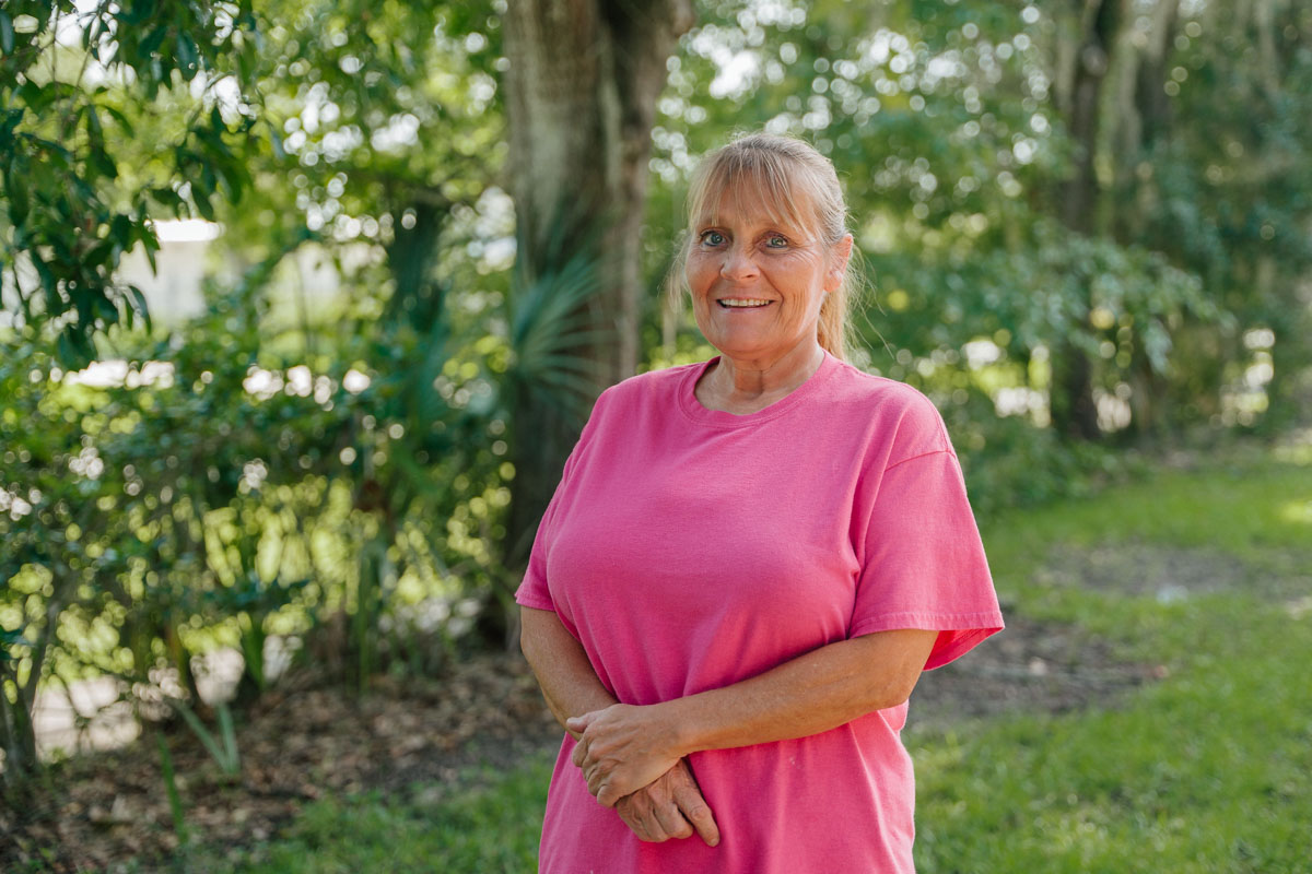 Photo of Debbie posing outside the Training Center in Apopka.