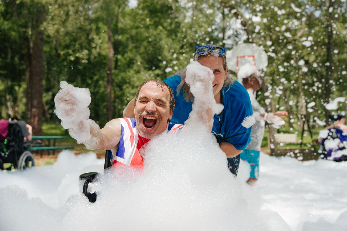 Bill playing with the foam at one of Camp Thunderbird's foam parties.