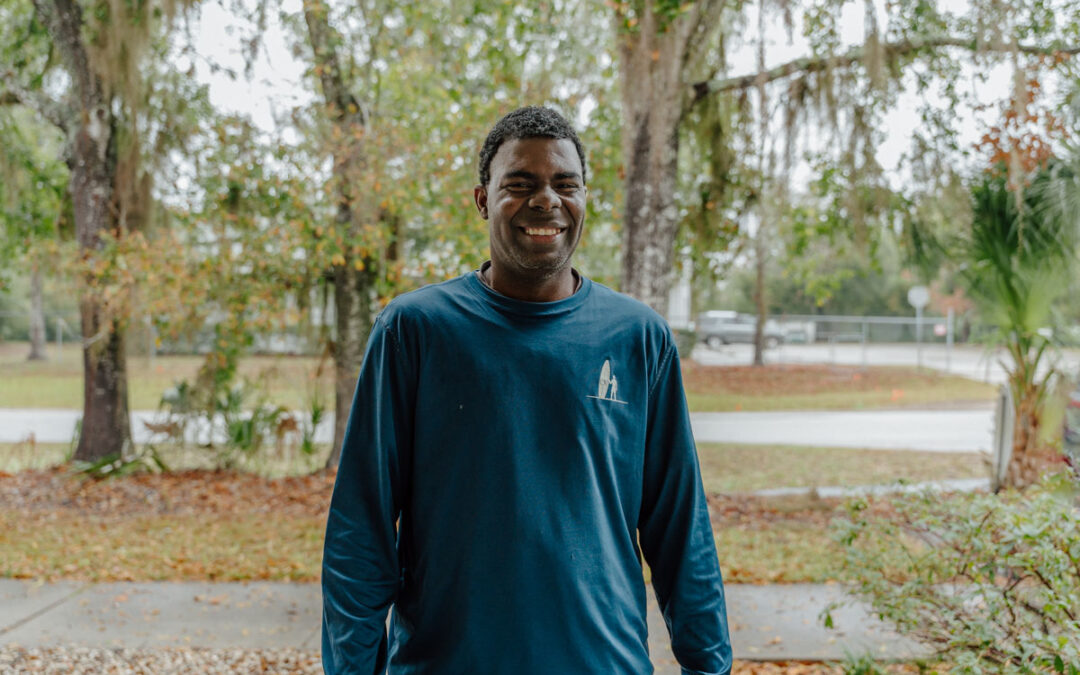 Tarrence Darden smiling in front of Quest's Training Center Apopka.