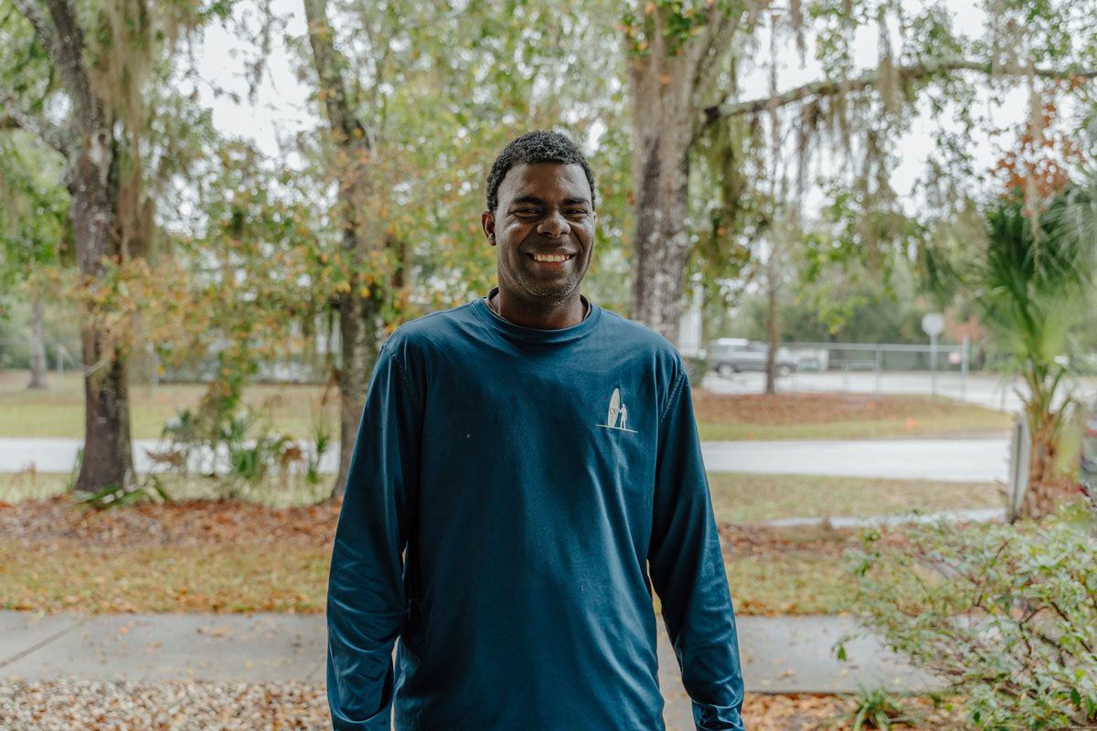 Tarrence Darden smiling in front of Quest's Training Center Apopka.