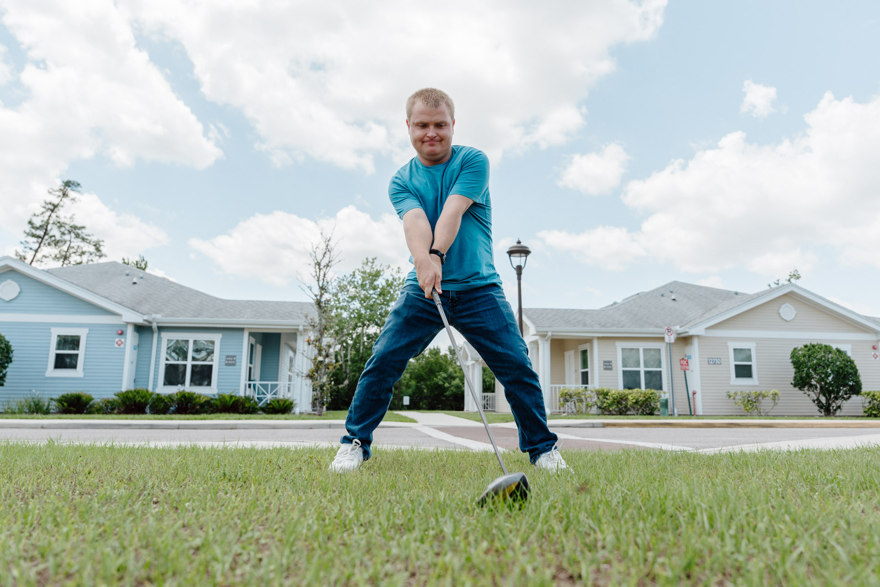 Brad practicing his golf stance at Quest Village.
