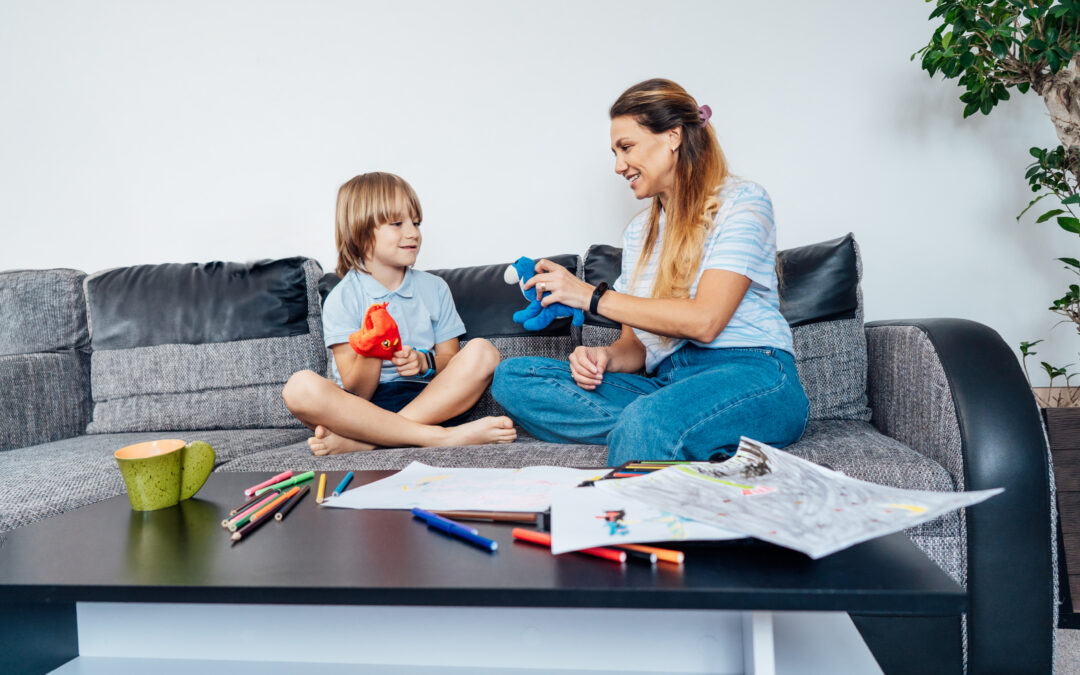 Happy mother and son working on aba therapy goal together