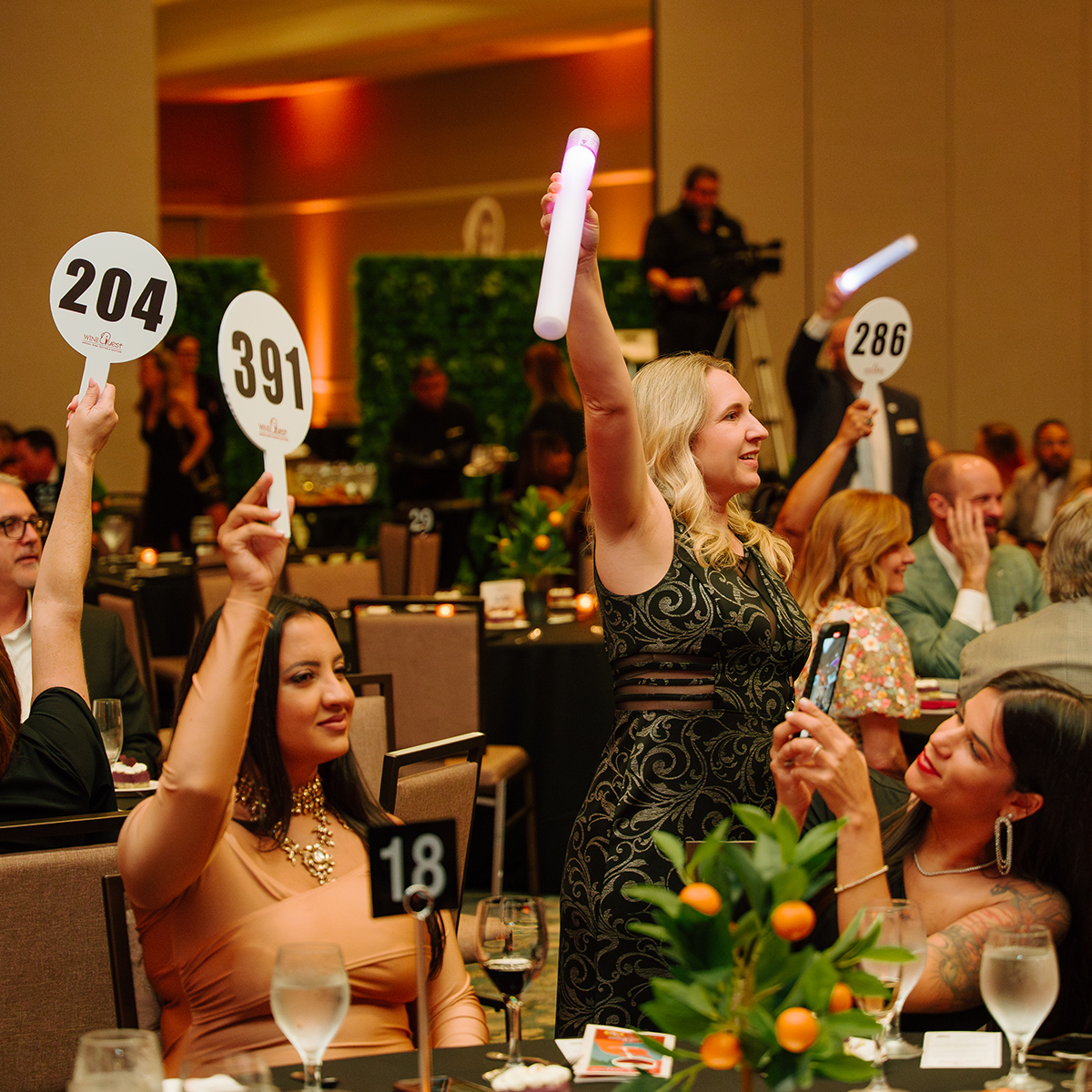 Server pouring drink at Wine Quest dinner.