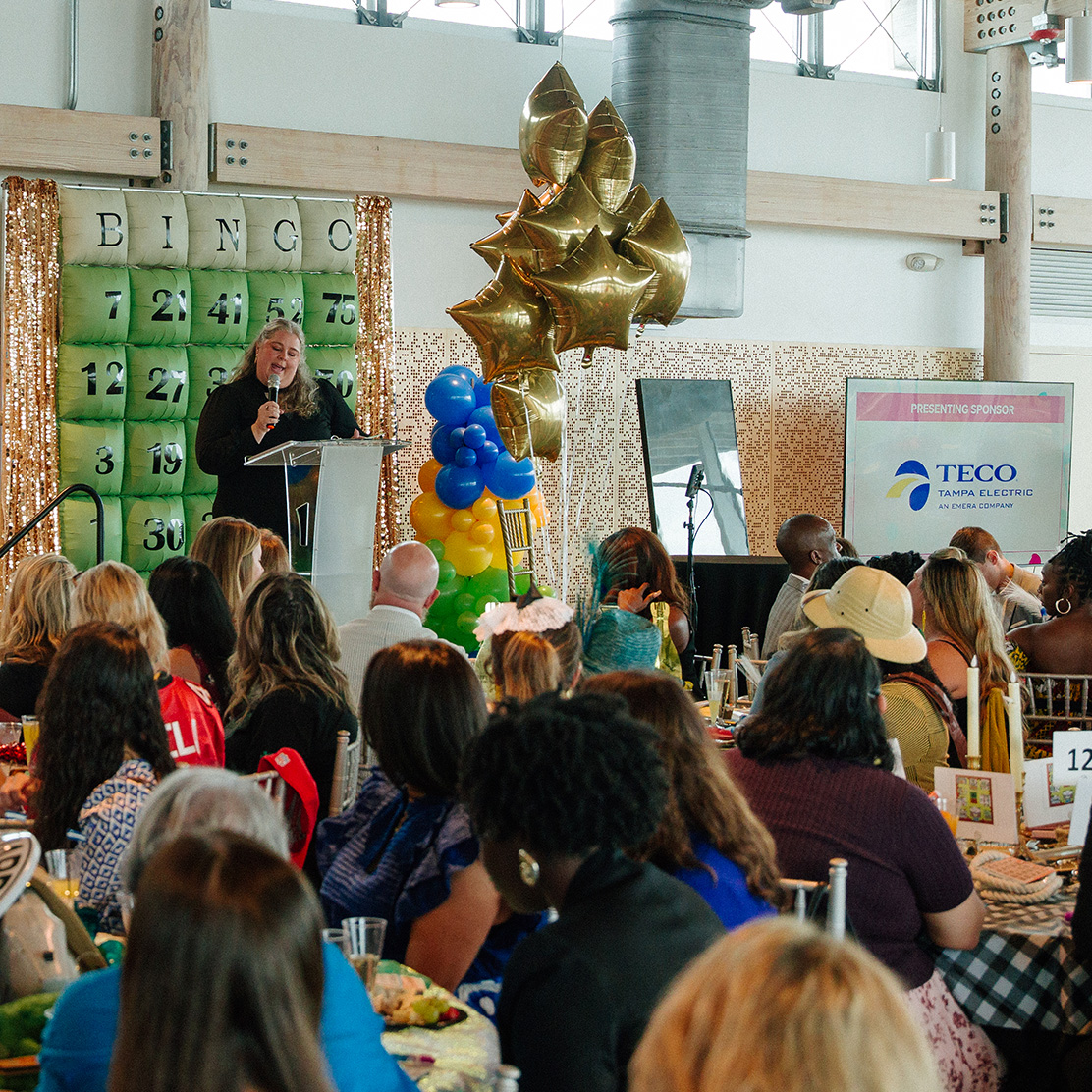 Server pouring drink at Wine Quest dinner.